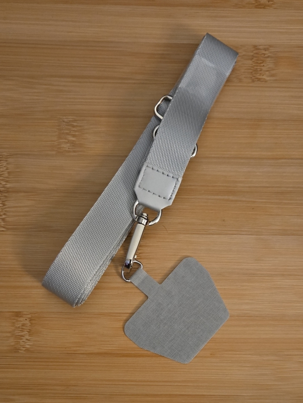 Adjustable Gray Vell Phone Crossbody Strap.